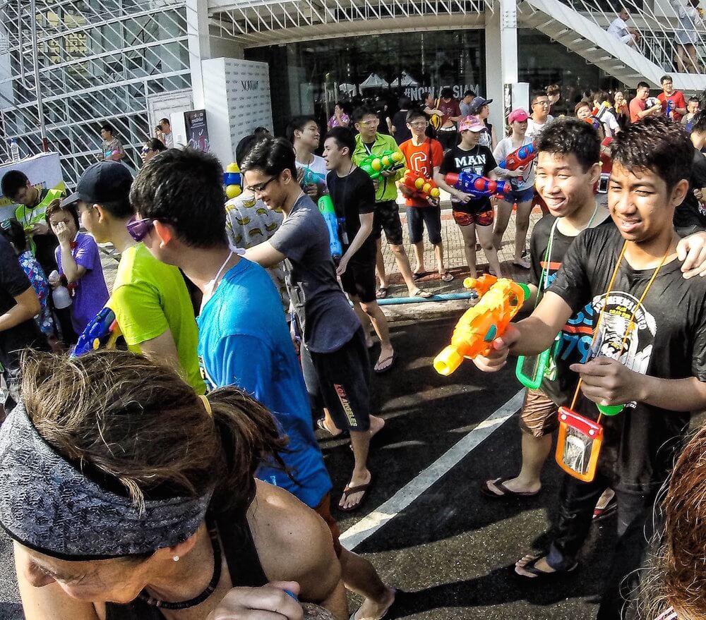 Lots of thai people out with smiles and waterguns