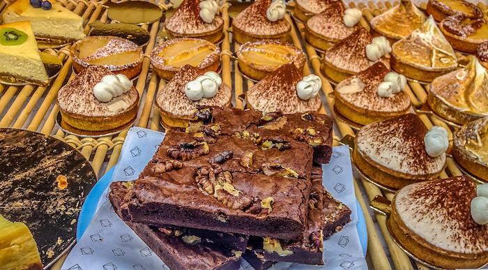 Gluten free in Paris | An array of chestnut and lemon tarts and a huge brownie
