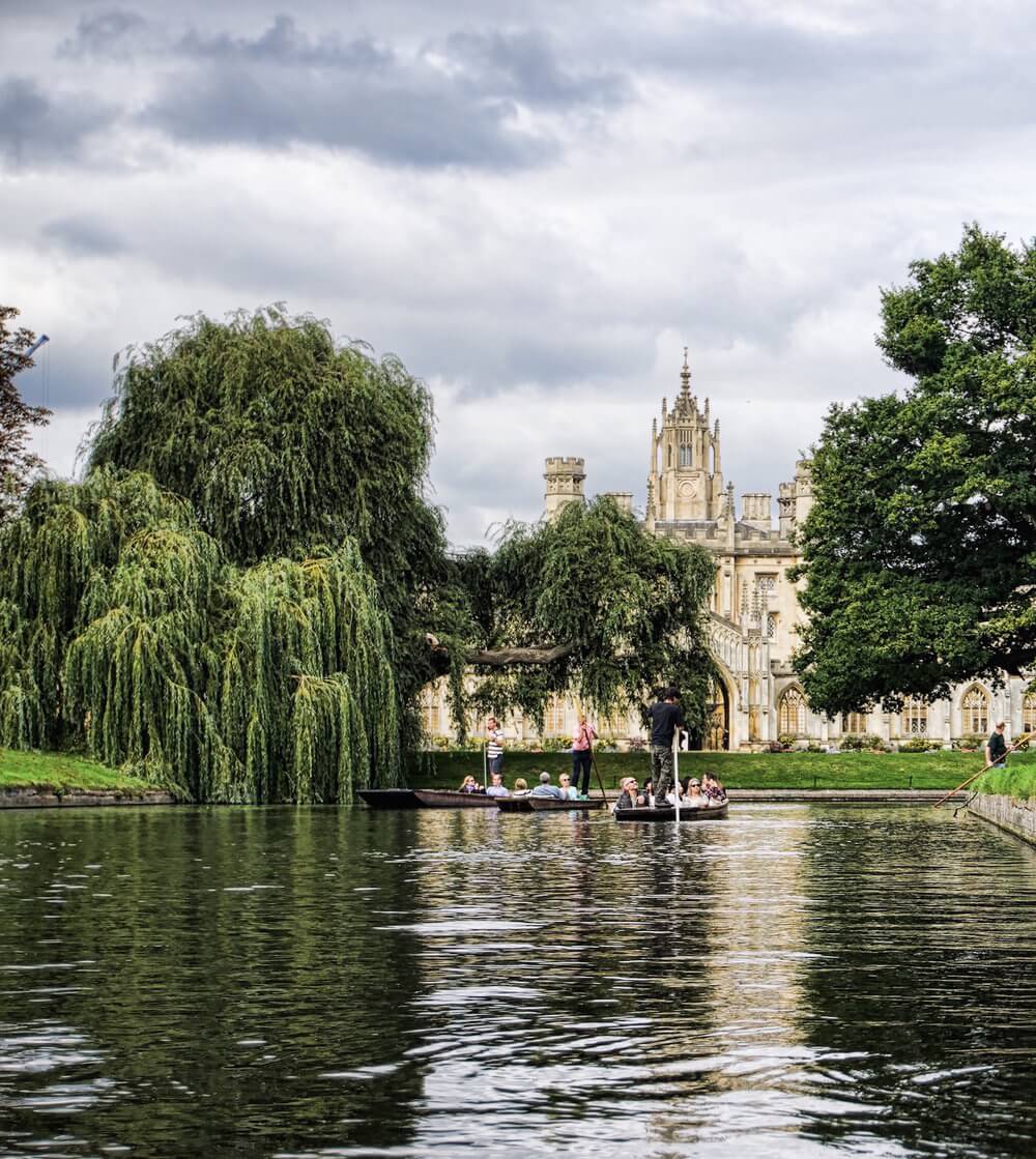 Punting down the River Cam; St John's College in the back with its absence of clock-faces