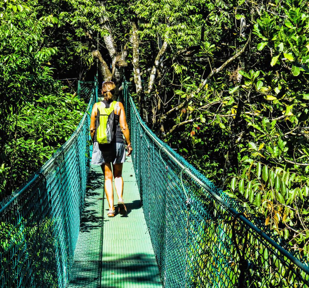 Nomadic Life: walking across a suspension bridge,Montezuma, Costa Rica