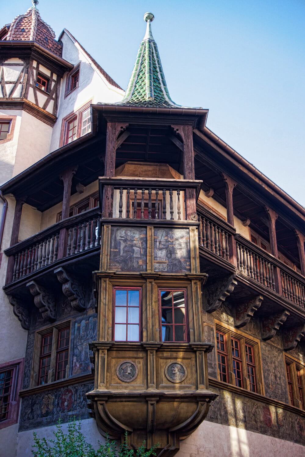 Colmar France: corner wooden building with balcony