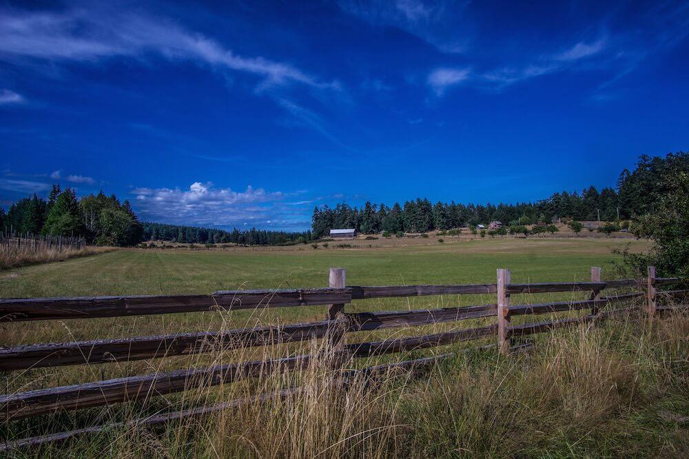 Salt Spring Island BC: farmland and wooden fence, big skies