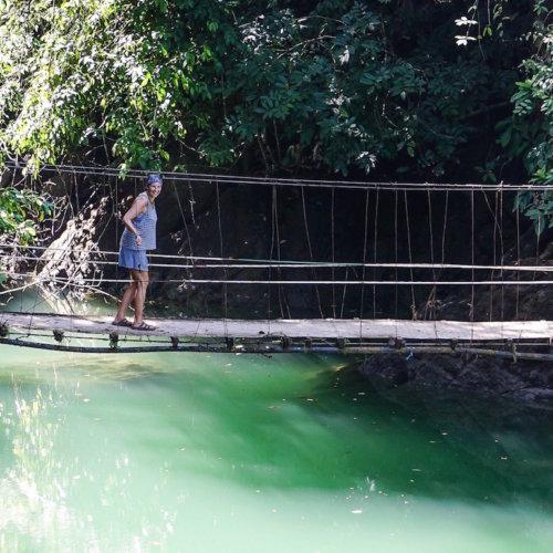 Crossing a rickety swinging bridge in Drake Bay, Costa Rica