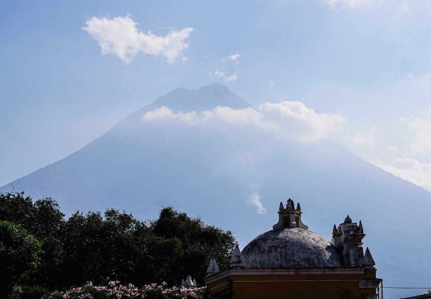 Antigua Guatemala: colonial rooftops with the volcano in the background