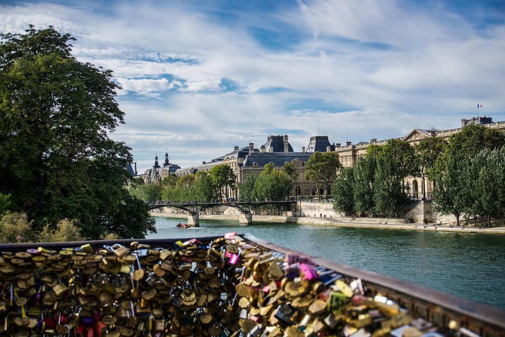 locks locked to the bridge overlooking the Seine