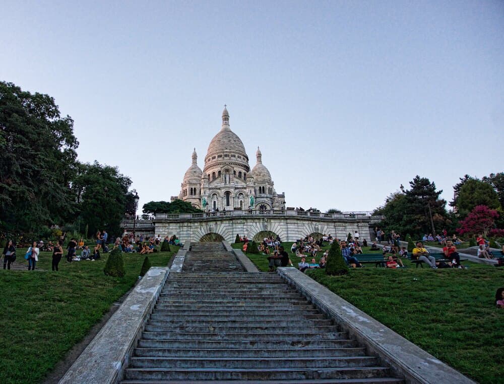 looking up all the stairs at Sacré- Coeur - don't miss this Paris experience