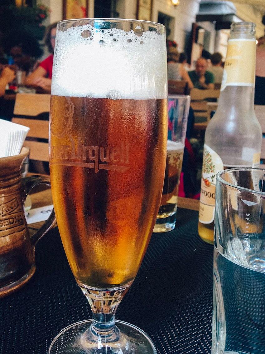 a tall glass of frothy beer