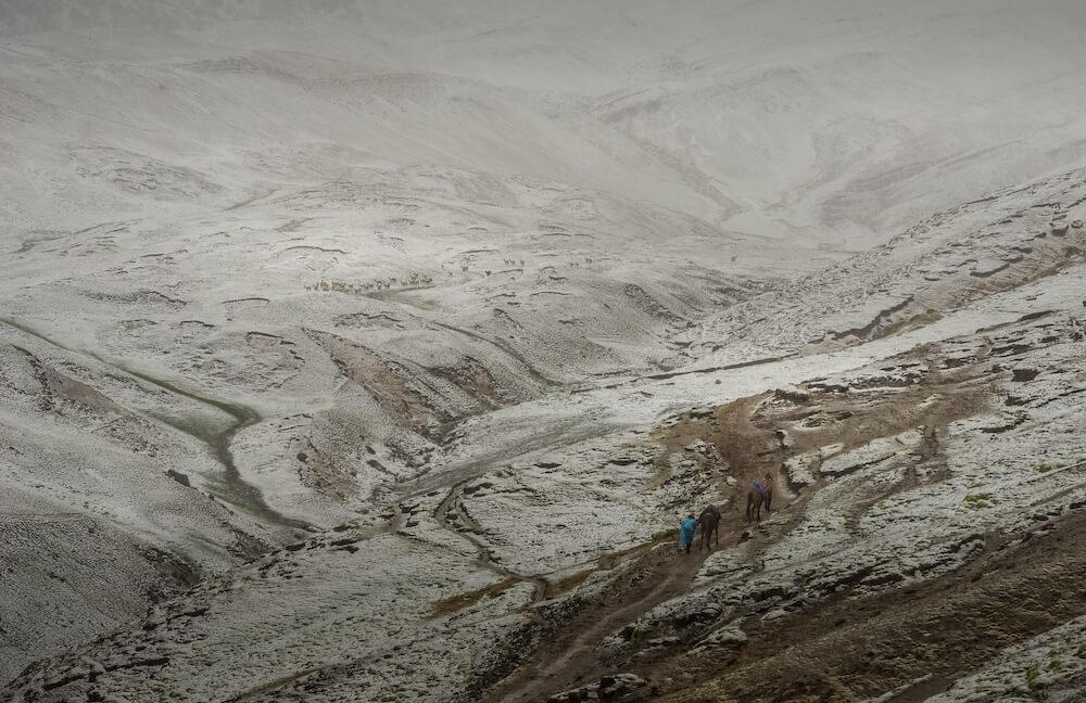 the snowy descent from the Rainbow Mountain trek in Peru