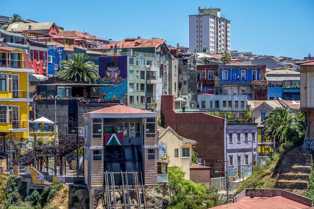 Things to do in Valparaiso Chile - the skyline of Valpo with street art and an ascensor