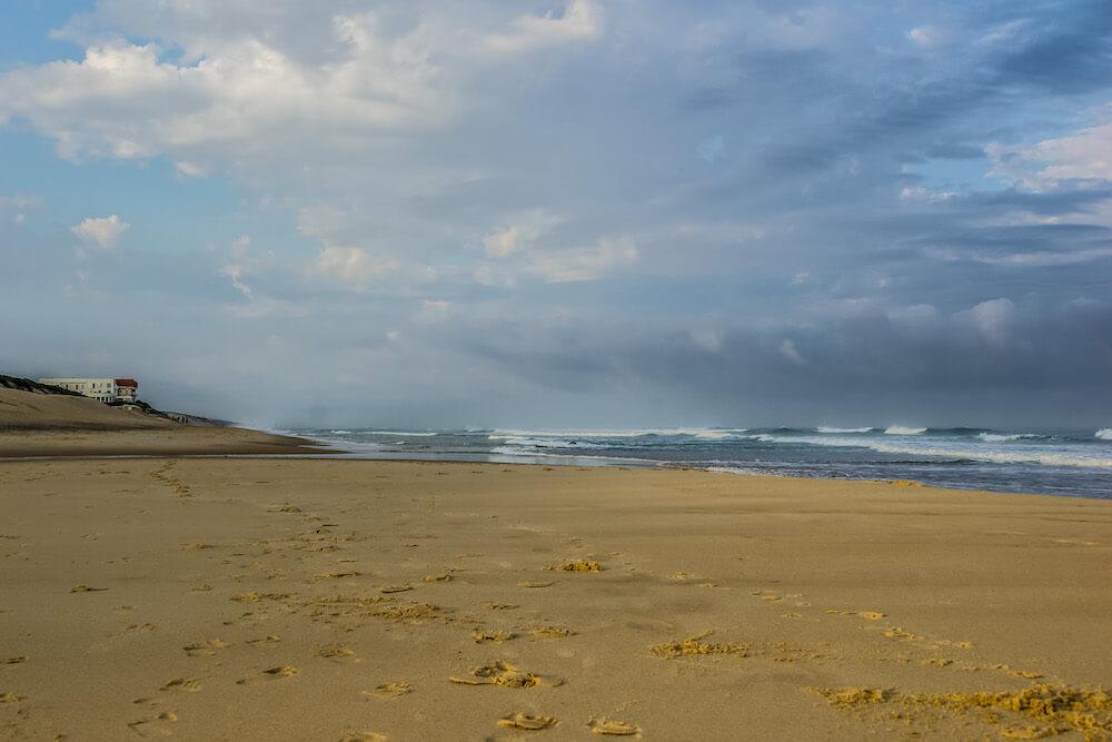 Solo travel as a woman: View of golden sand and ocean at Biscarrosse Beach, France