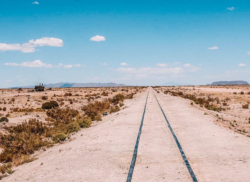 Solo travel as a woman: Abandoned railway lines stretching out to the horizon, Uyuni Bolivia