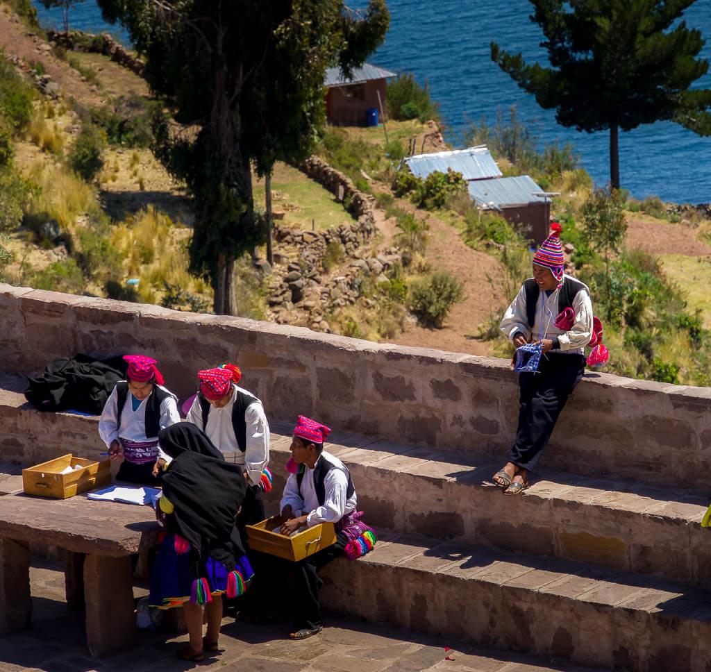 Onward travel in Peru: Men knitting on Taquile Island, Peru