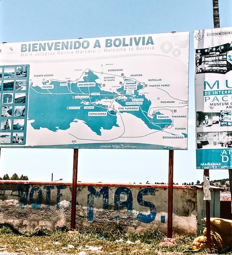 Proof of onward travel: Blue sign welcoming you to Bolivia