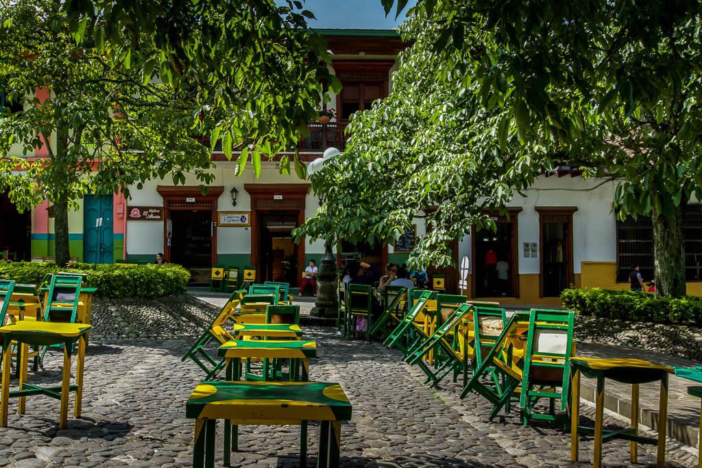 Jardin Colombia: main plaza all the yellow and green chairs are tipped against the tables