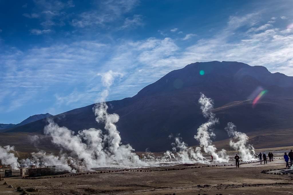Steaming geysers. Andes mountains behind