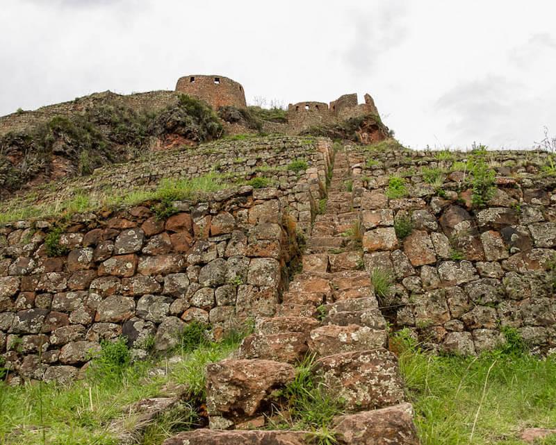 Steep uneven stone staircase in the Inca Ruins in Pisac Peru