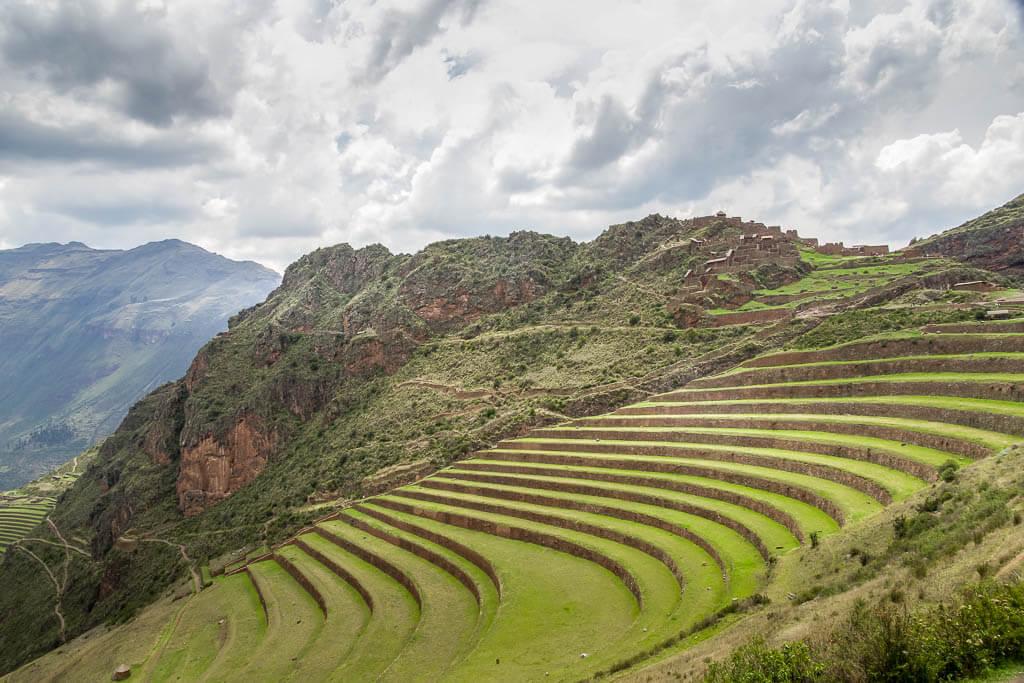green terrraced steps carved into the steep hillside at Pisac Peru