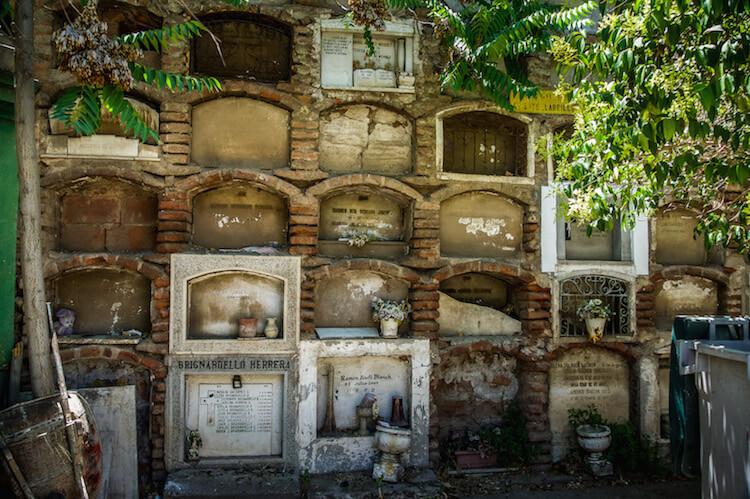 Things to do in Santiago Chile | the cemetery had stacked graves. Here are 15 Small arched doorways, all stacked on top of each other