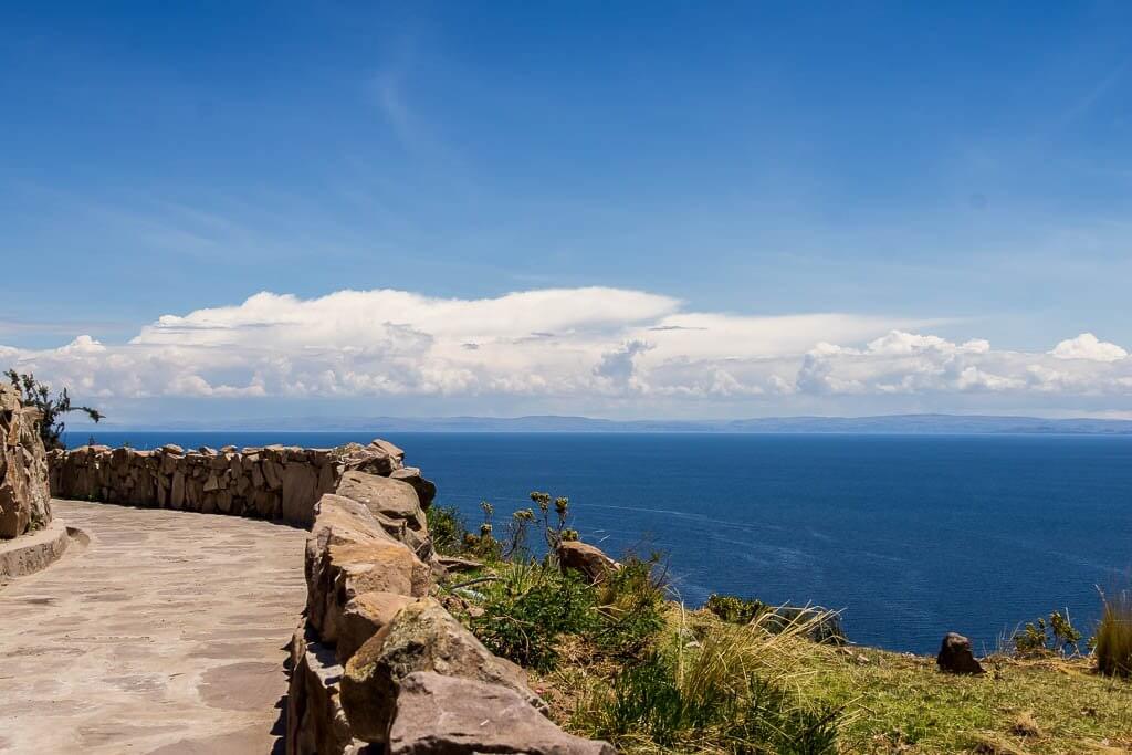 stone walkway with the expansive blue waters of Lake Titicaca