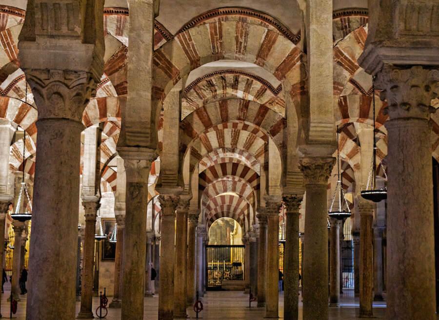 Travelling in Spain: the red and white archways in the Mezquita in Cordoba
