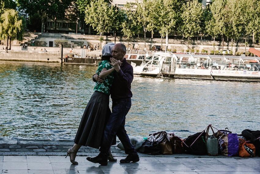 couple dancing tango by the Seine