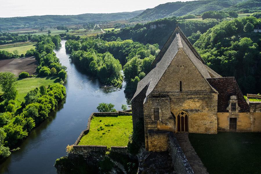 View from Beynac over Dordogne Valley. Church, river and forest