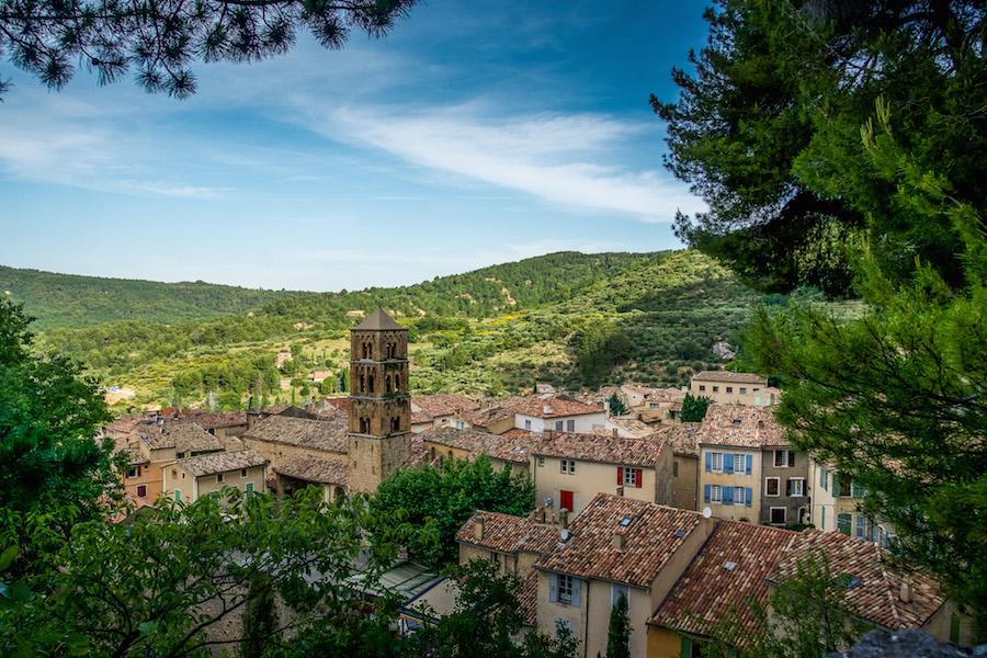 Moustiers-Sainte-Marie France: the view of red rooftops and a square church tower