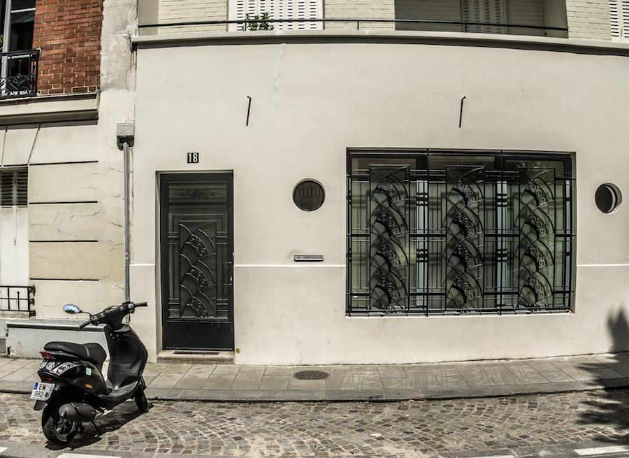 Paris streets: white building with black art deco designs on Villa d'Alésia