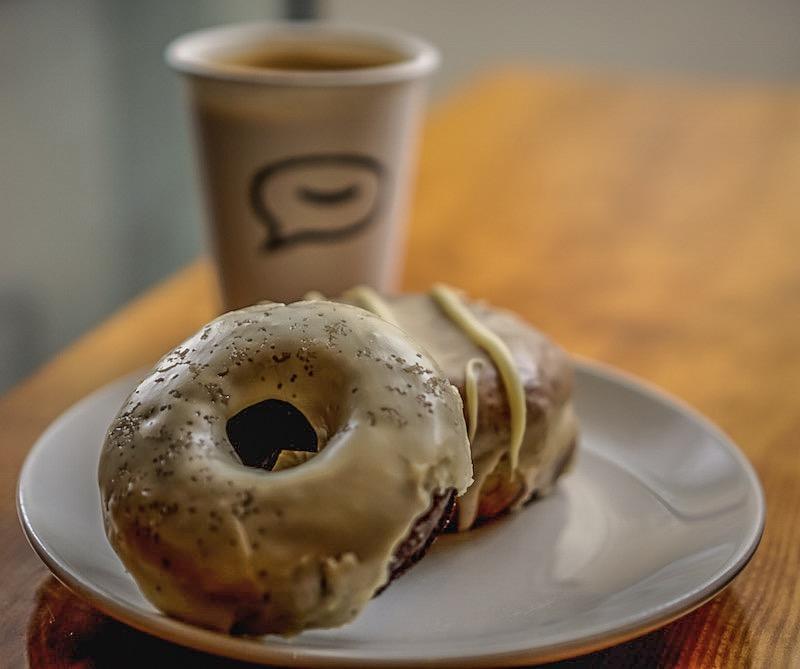 vegan donuts at Cartems, coffee in the background