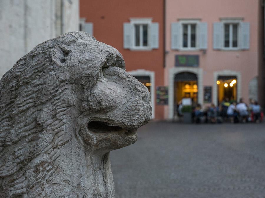 Things to do in Trento Italy: lion statue in the foreground