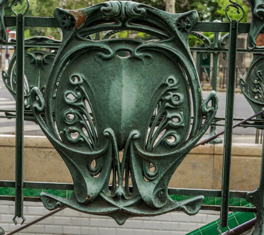Art Nouveau in Paris - Guimard's green iron fence around the station with the fancy M denoting Metro