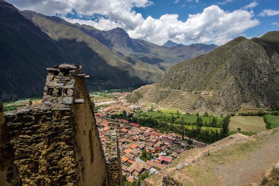 Ollantaytambo Peru: looking over red roof tops and to the other site of Inca ruins