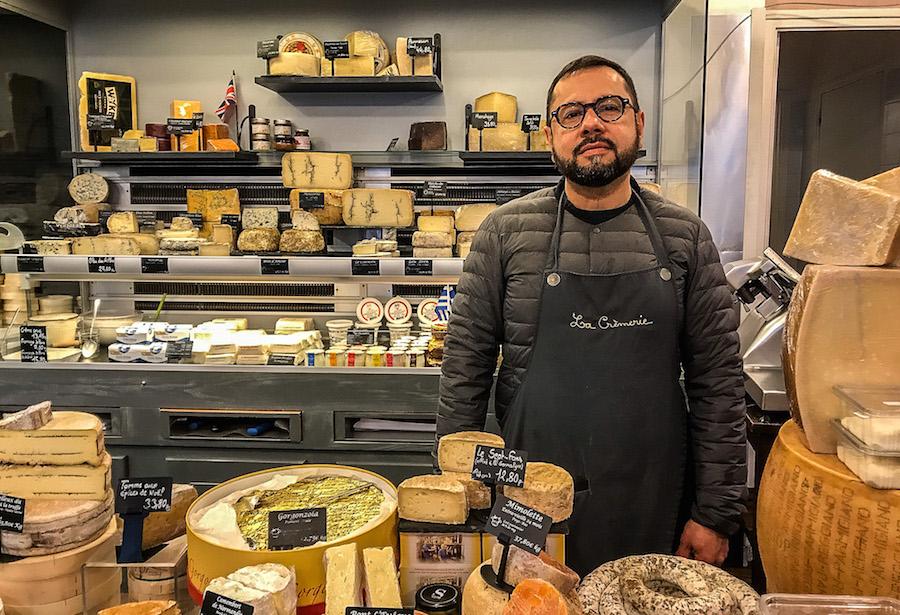 Cheese shop in Paris 10 -  the man with the beard and glasses is waiting to serve you