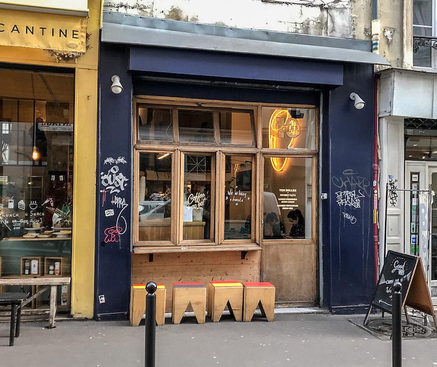 café Canal Saint-Martin: blue facade with windows and tiny stools on the sidewalk