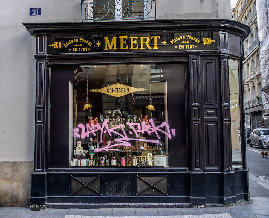 Paris during Coronavirus - some storefront windows are covered in graffiti tags