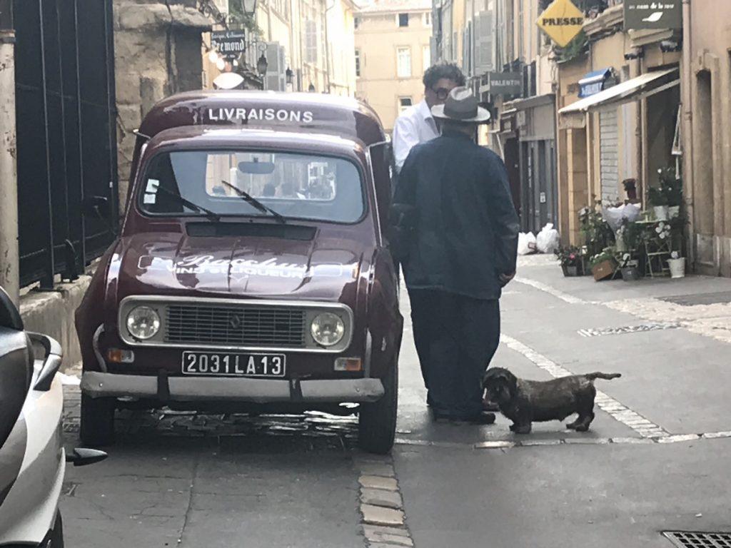 Aix-en-Provence - watch the people. This old fashioned delivery truck with 2 men and a Daschund standing in the street
