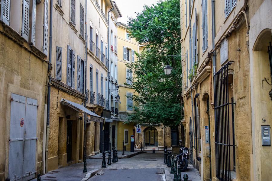 What to do in Aix-en-Provence:  walk the streets full of yelllow buildings, green trees and grey shutters