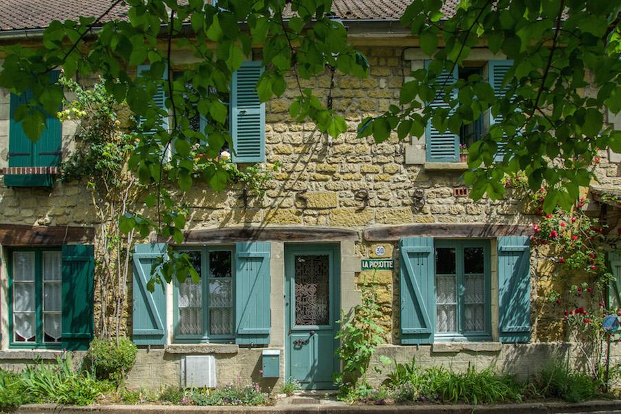 Auvers-sur-Oise has plenty of lovely stone homes with shutters.These aqua shutters frame the house.