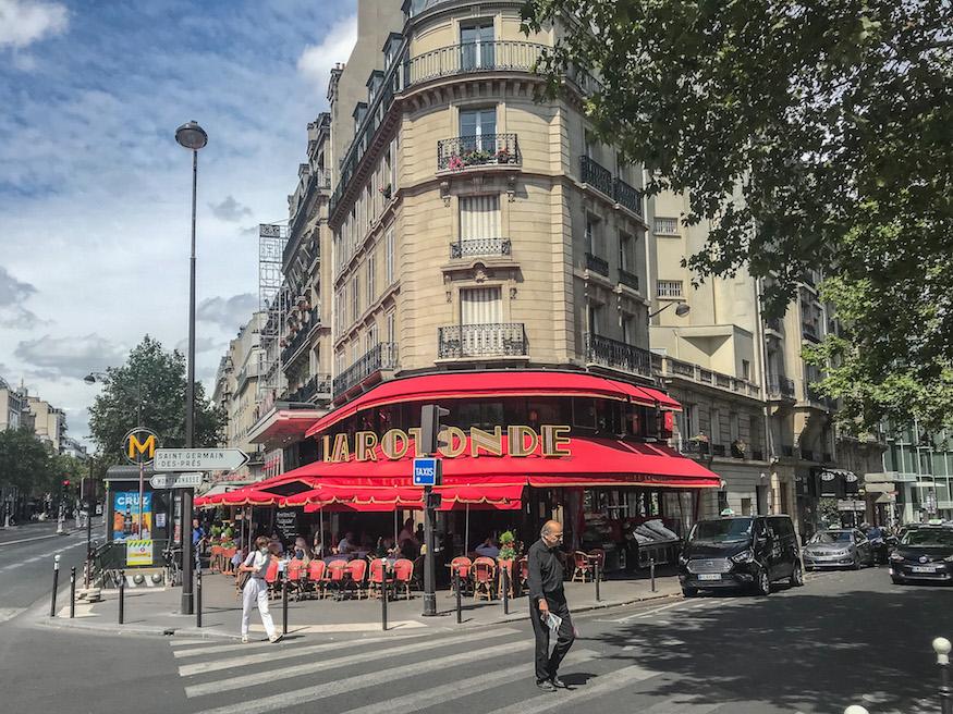 La Rotonde in the 14th arrondissement of Paris. Its lovely red awning on the corner makes it hard to miss. 