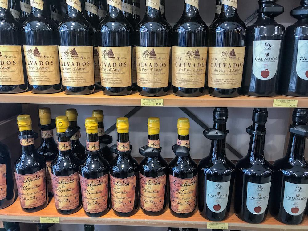 rows of bottles of Calvados