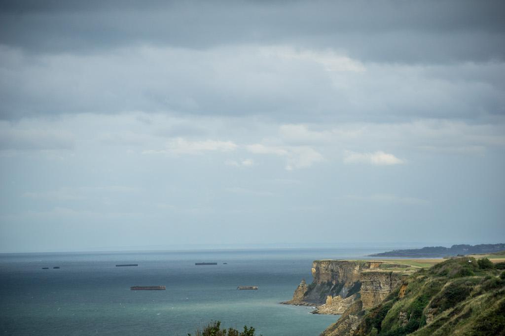 How to visit the D-Day beaches of Normandy France  = the remains of Mulberry Harbour floating in the English Channel