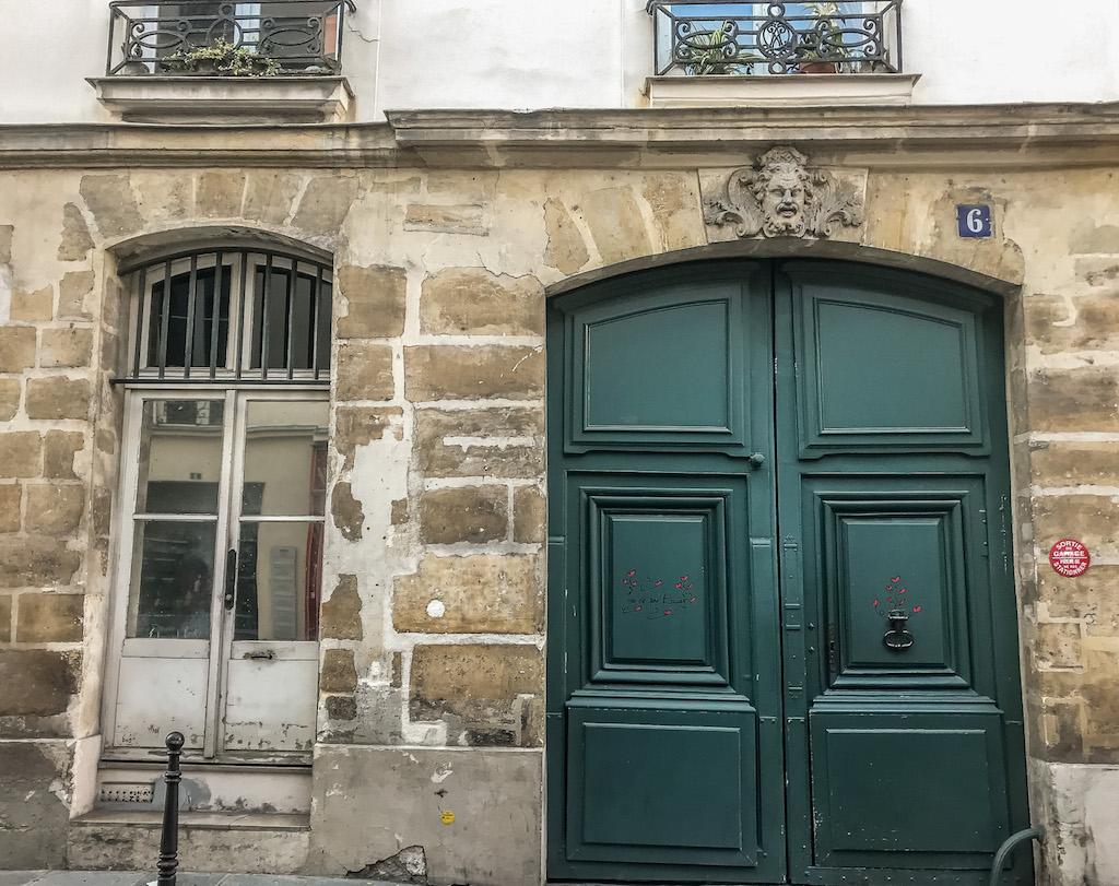 le marais district  - the faces at the top of the doorways are called mascarons