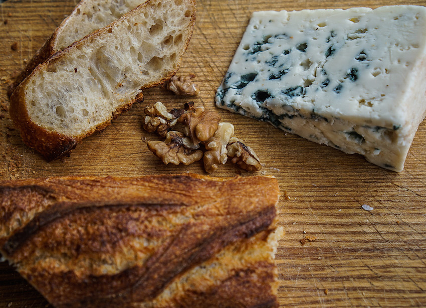 Roquefort one of the favourite cheeses in France with a bageutte and walnuts