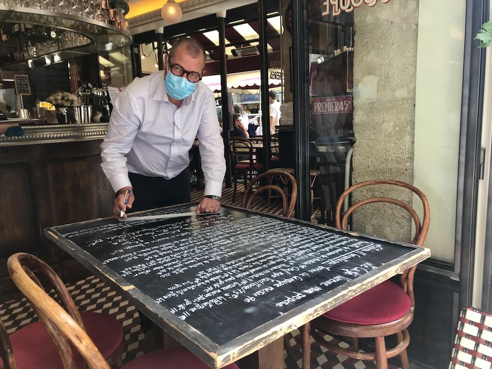 Getting the menu ready at Cafe Varenne on the corner of rue du Bac and rue de Varenne