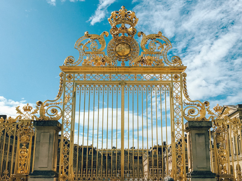 Golden entry gate at Versailles Palace